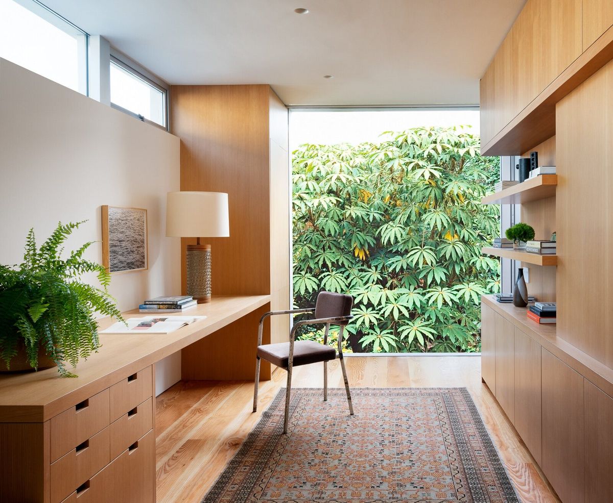 Altair: Study with an fir built-in desk and shelving facing a wall of greenery