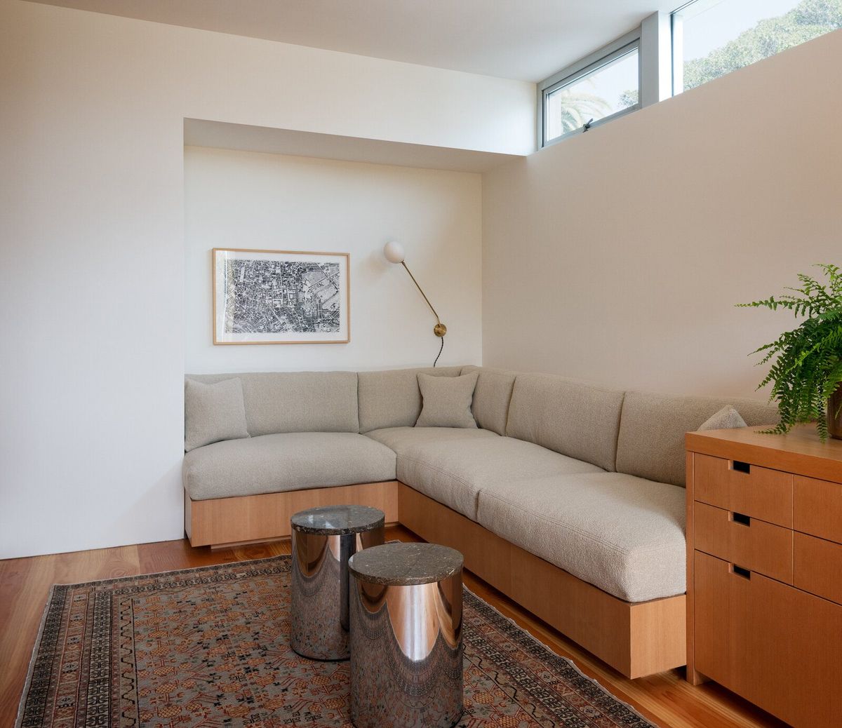 Altair: Den with a built-in sectional on an fir base under clerestory windows