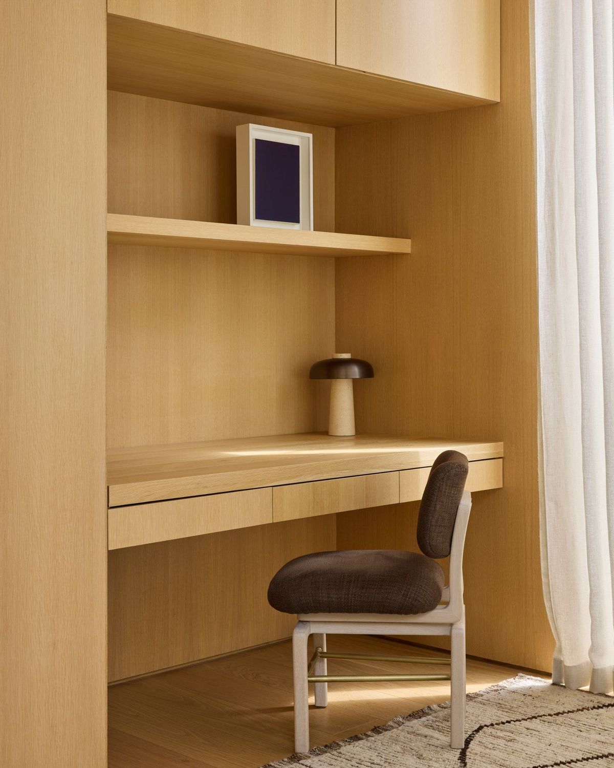 Ashcroft: Built-in oak desk niche with open shelving and a chair