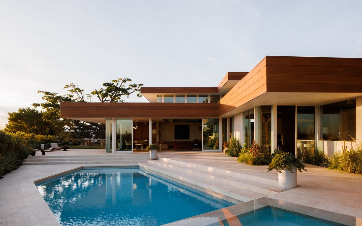 Carla Ridge: House and pool terrace at golden hour with the ridgeline beyond