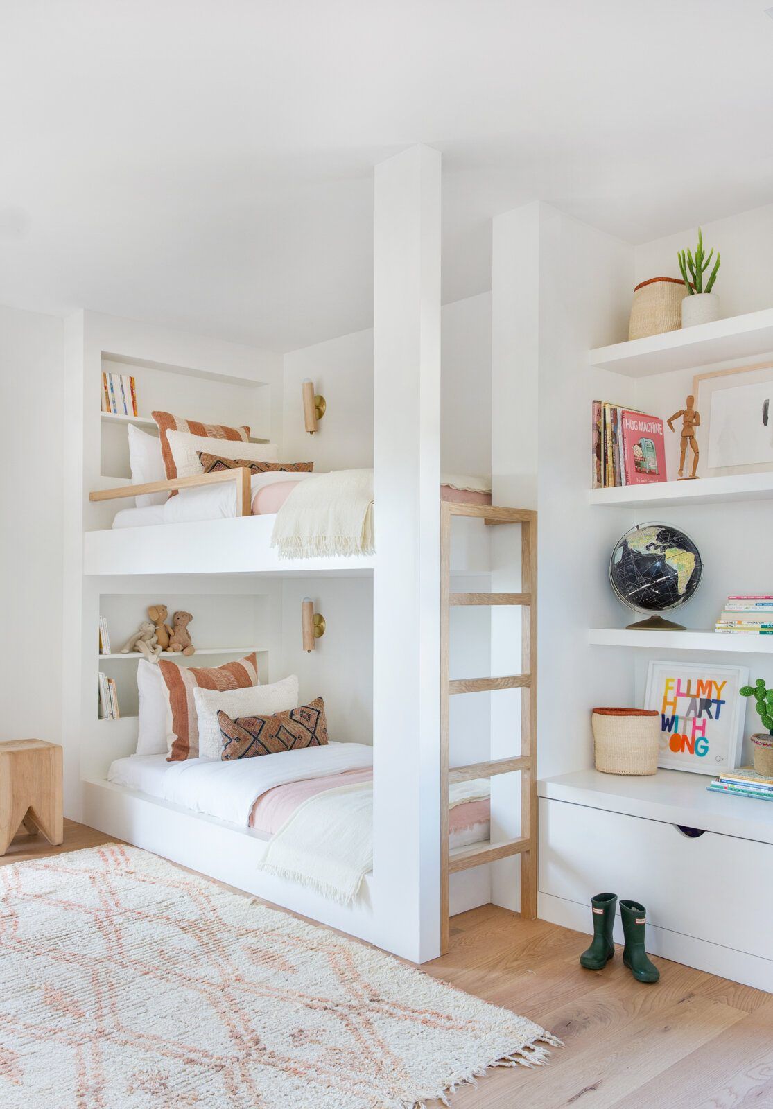 Flower: Built-in bunk beds with a ladder beside open shelves