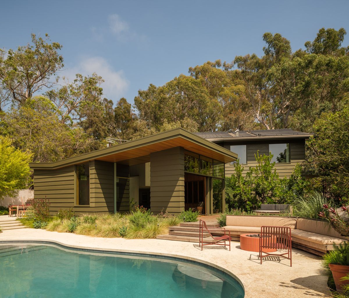 Latimer: Mid-century house and pool in a landscaped garden with mature trees