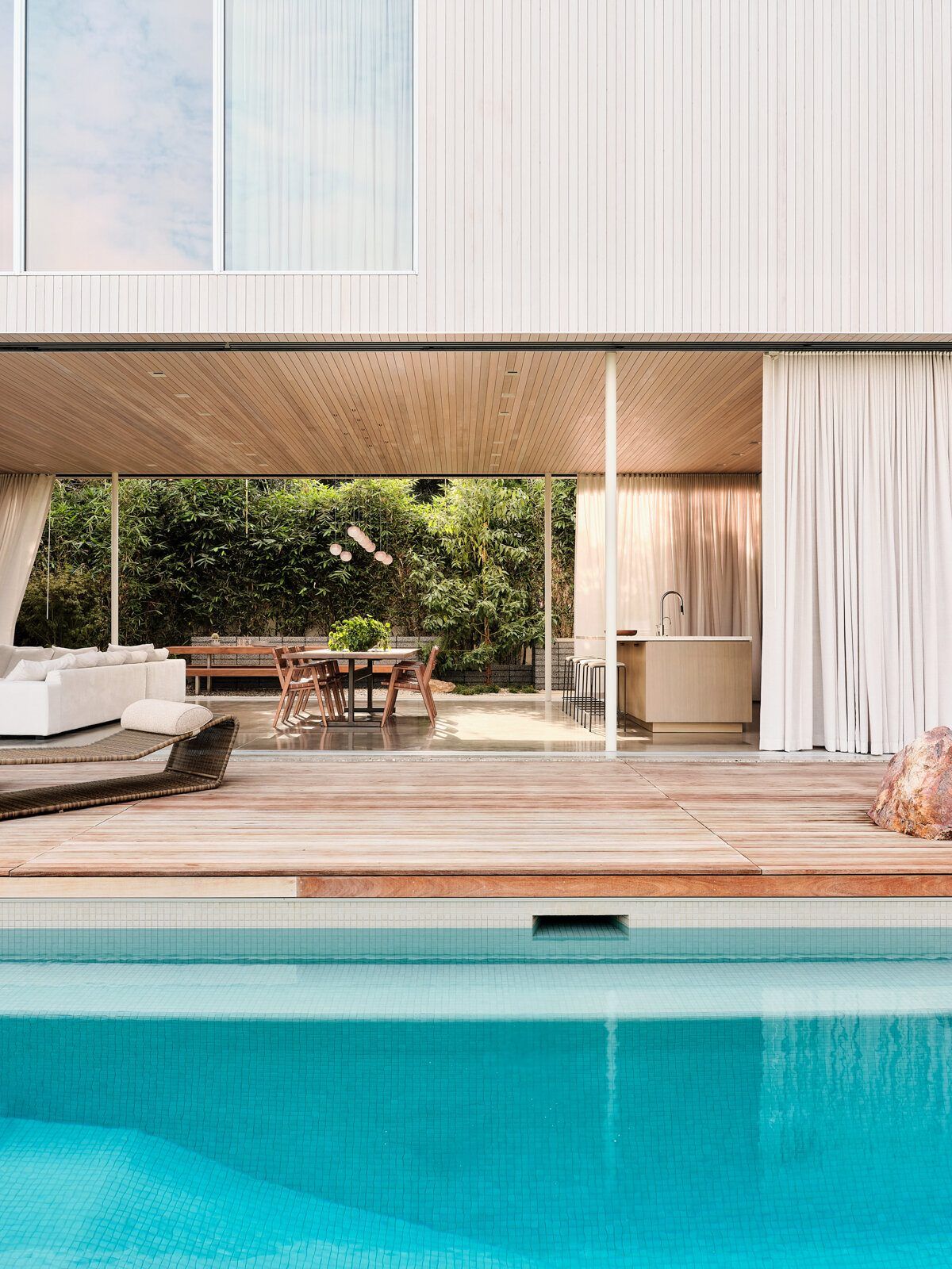 Modjeska: Tiled pool and teak deck in front of the open living room