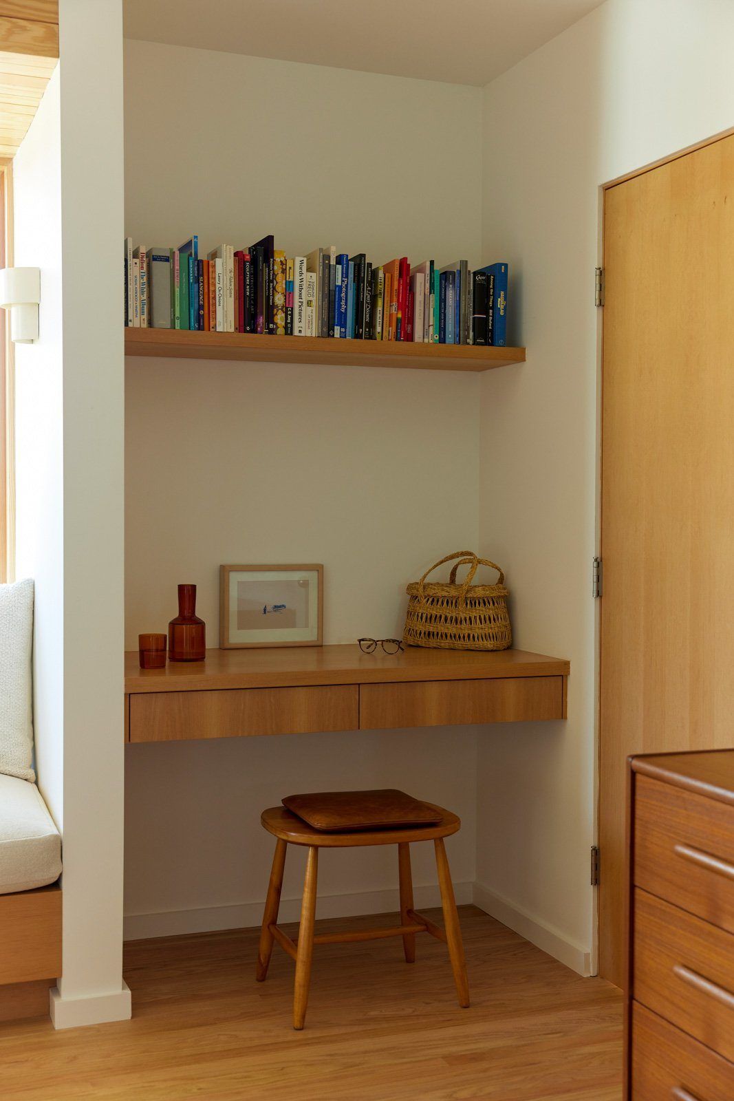 Stewart: Built-in desk nook with a bookshelf and wood stool