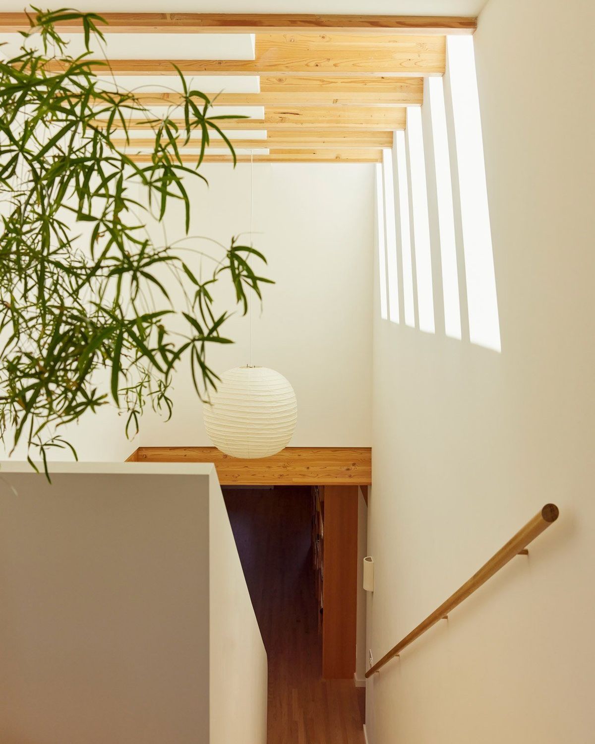 Stewart: Stair landing lit by a slot window and paper lantern